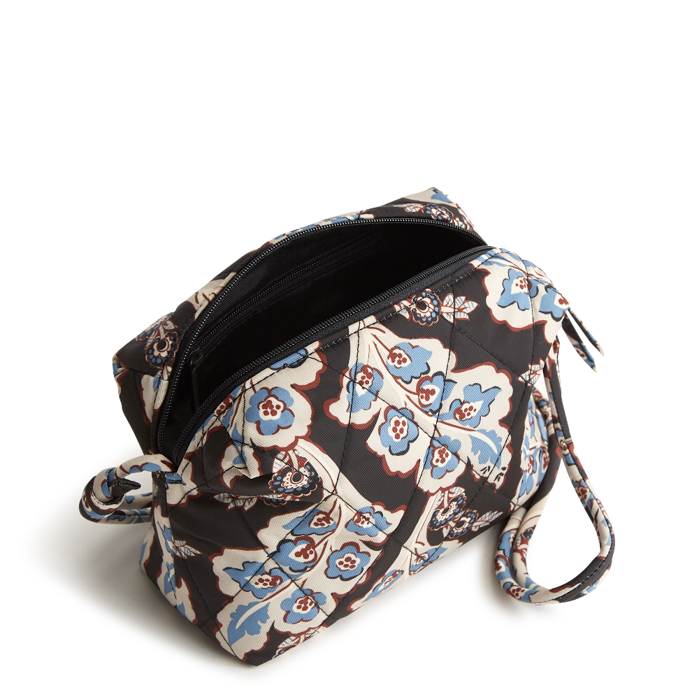 Designed for the minimalist at heart, this compact and versatile bag offers the perfect blend of style and functionality for those who prefer to travel light. The bag is shown in Vera Bradley's New Day Pattern, Calyx Quil Black.