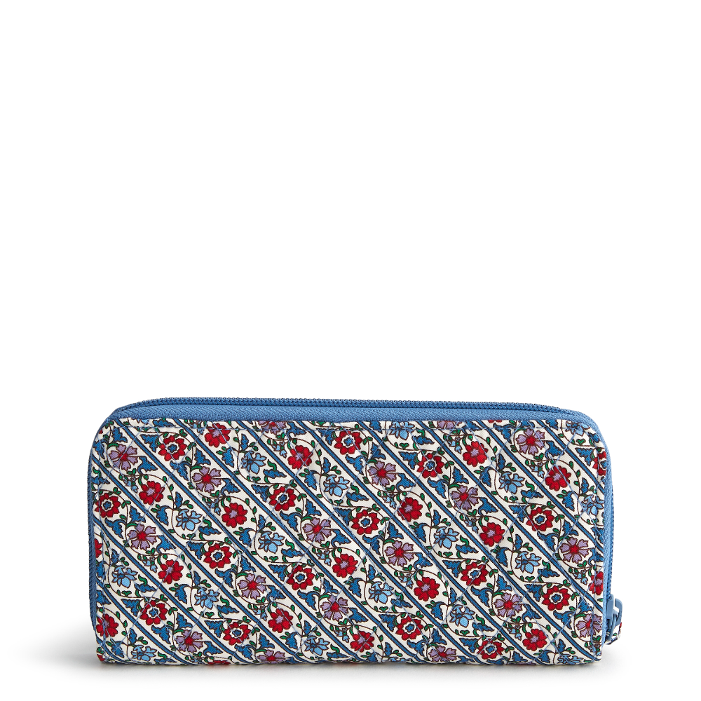 A Vera Bradley New Day wallet designed out of cotton gabardine, in the pattern Bias Mini Vines Ribbons.