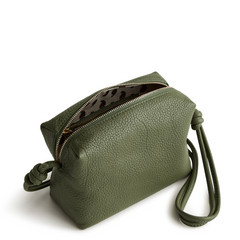 A leather crossbody purse in the color green, designed by Vera Bradley from the Vera Bradley New Day launch. This crossbody is shown in the Vera Bradley pattern Bronze Green.