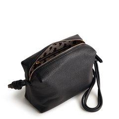 A leather crossbody purse in the color black, designed by Vera Bradley from the Vera Bradley New Day launch. This crossbody is shown in the Vera Bradley pattern Moonless Night.