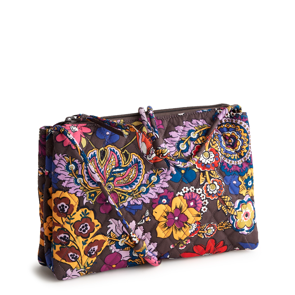 A brown color purse with yellow and purple artwork from Vera Bradley, shown in the Colorful Bouquet pattern.