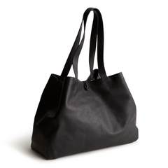 A black color tote bag from Vera Bradley New Day launch. The tote bag is made out of leather, and is shown in the Vera Bradley Pattern Moonless Night.