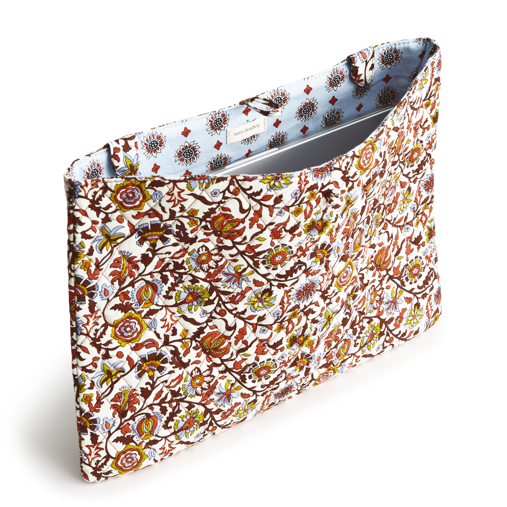 A white laptop insert showing a flower fabric, designed by Vera Bradley. This laptop insert is shown in the Vera Bradley Pattern, Marrakesh Vines Cream.