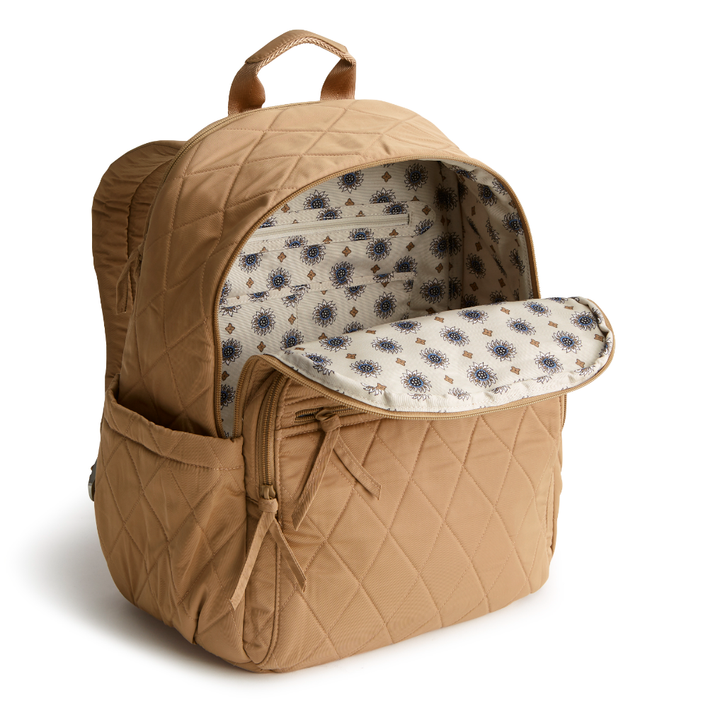 A tan color Bancroft Backpack from Vera Bradley New Day. The backpack is designed from Polyester Twill. This bag is shown in pattern Tiger's Eye.