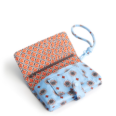 A phone wristlet case made from cotton gabardine, shown in the Vera Bradley pattern Marahesh Geos.