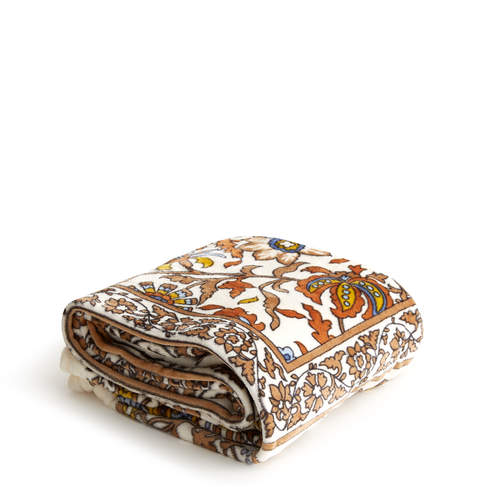 A plush throw blanket from Vera Bradley in Marrakesh vines Neutral.