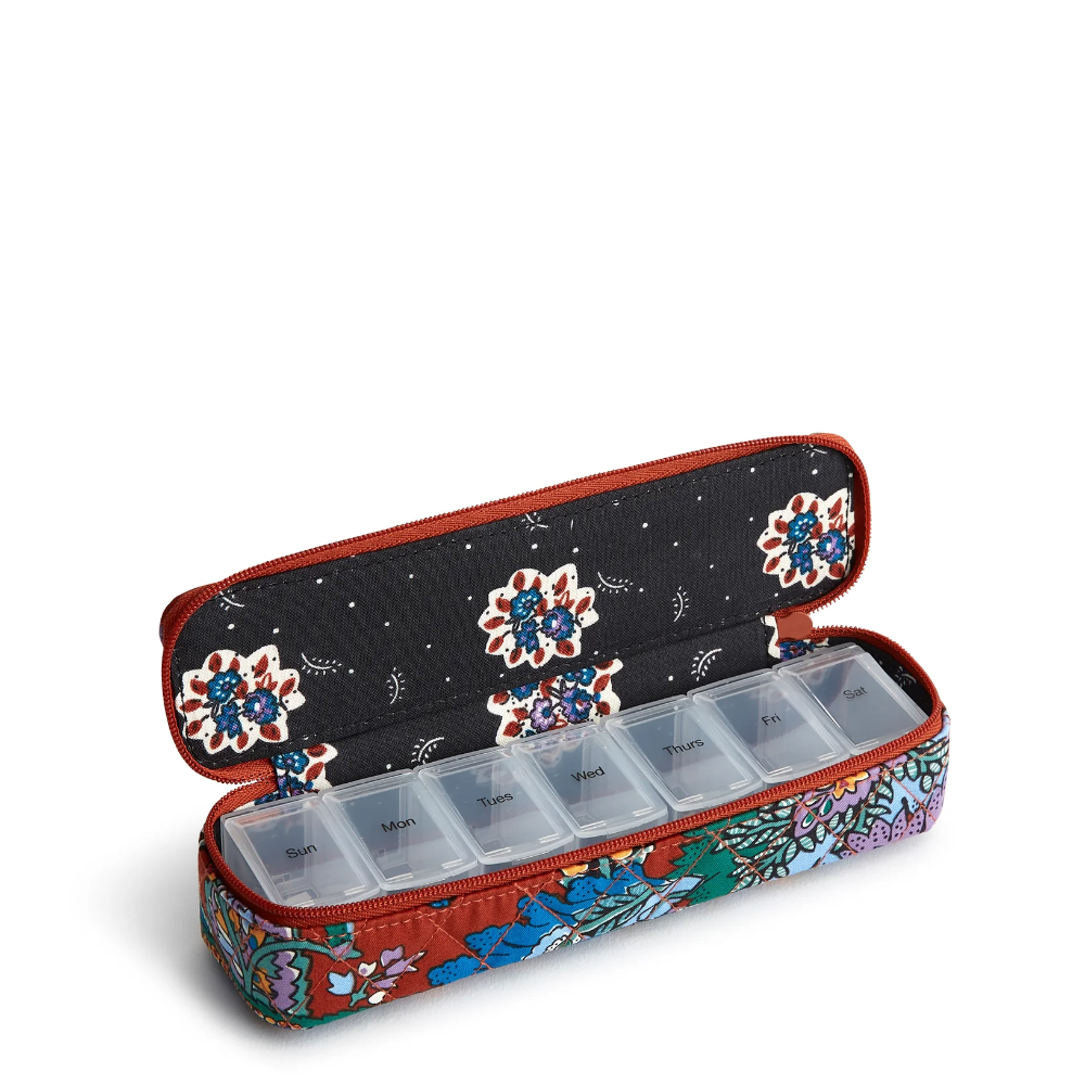 Travel pill case from Vera Bradley in Flowers + Feathers pattern.