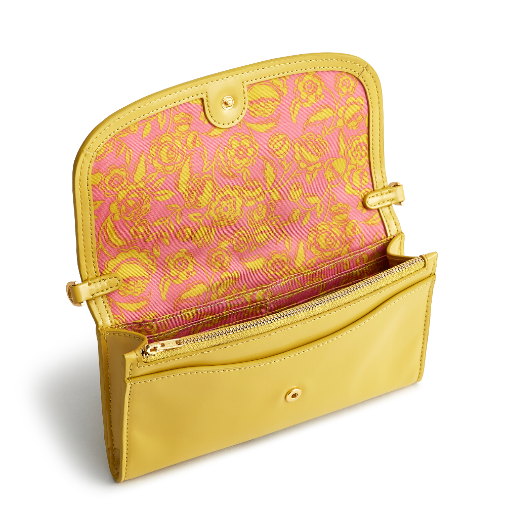 A Vera Bradley Wildwood Wallet Crossbody in Patent Faux Leather. Shown in the color gold.