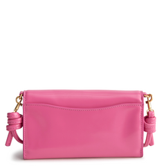 A Vera Bradley Wildwood Wallet Crossbody in Patent Faux Leather. Shown in the color pink.