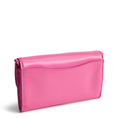 A Vera Bradley Wildwood Wallet Crossbody in Patent Faux Leather. Shown in the color pink.