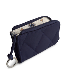 A Vera Bradley Zip Id Case Wallet in Zip Card Pouch in Polyester Twill fabric. Shown in the color blue.