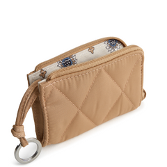 A Vera Bradley Zip Id Case Wallet in Zip Card Pouch in Polyester Twill fabric. Shown in the color tan.