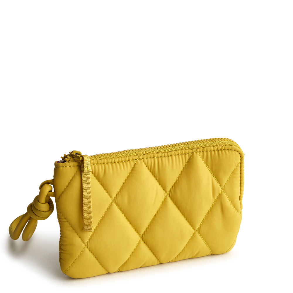 A Vera Bradley Zip Wristlet made from Nylon fabric in the color gold.