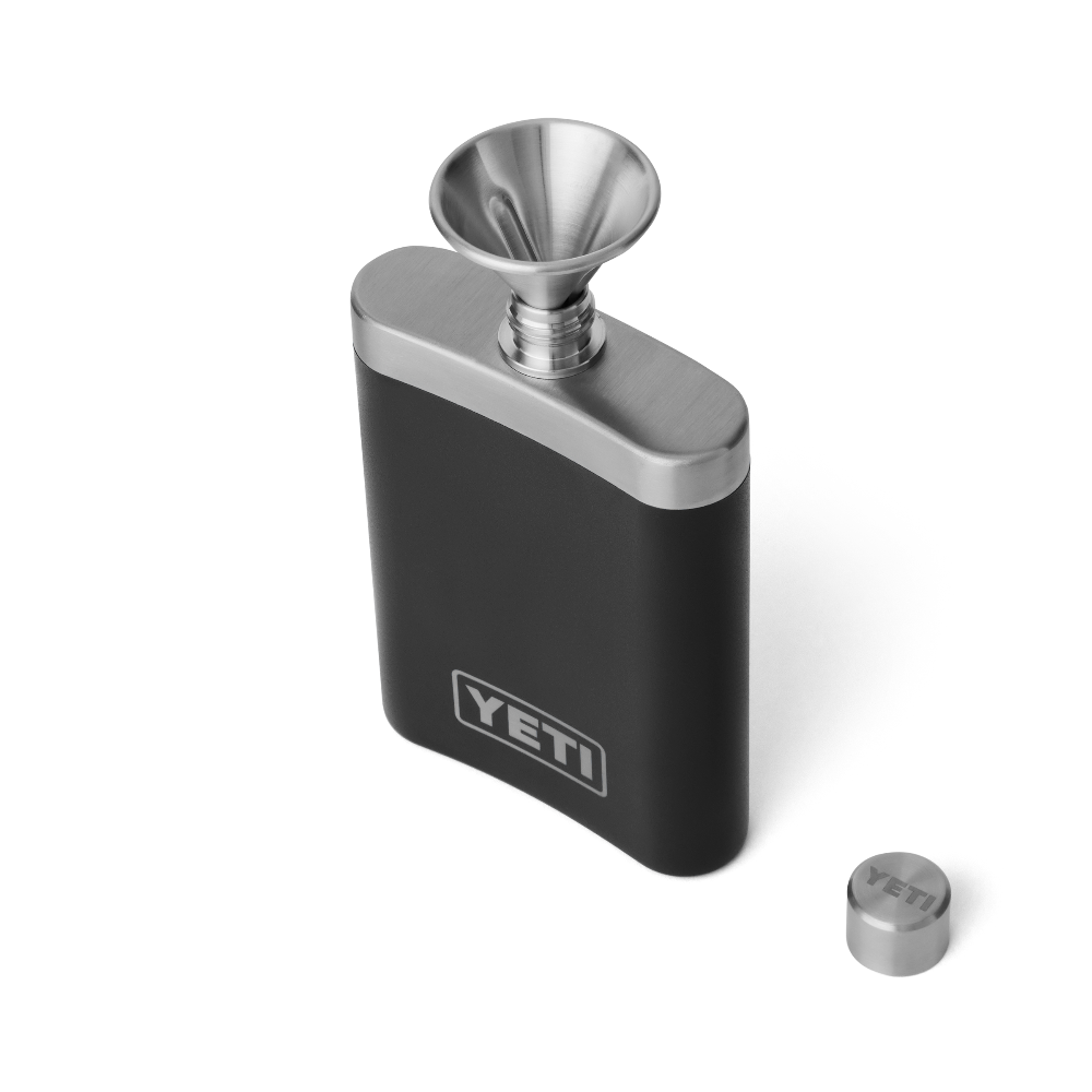 A black YETI flask with a silver top, silver YETI logo on the front, and a silver funnel on top for easy pouring.