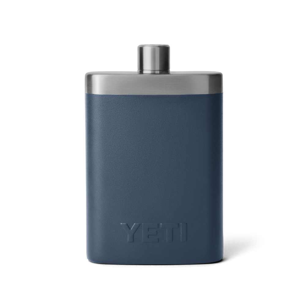 The back view of a navy blue flask with a silver top, and an all navy blue YETI logo on the back.