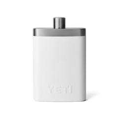 The back side of a white flask, with a silver top, and an all white YETI logo on the back.
