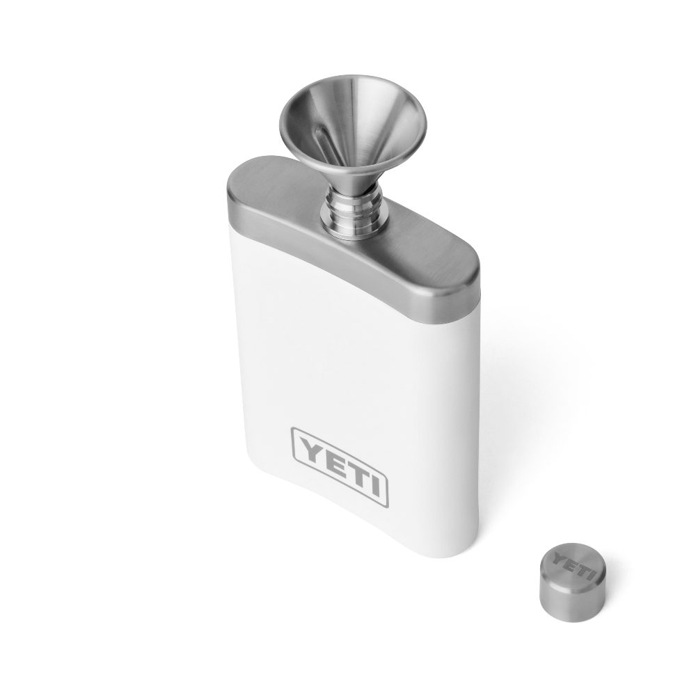 A white flask with a silver funnel on top for easy pouring, with a silver YETI logo on the front of the flask.