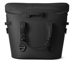 The backside of the M30 soft cooler, with a handle strap draped down in the color black.