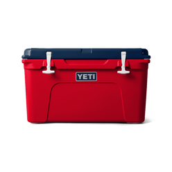 Front view of the limited edition 2024 YETI patriotic Tundra 45 Cooler. The top lid is navy blue, the base of the cooler is red, and the secure straps are white. The cooler shows a classic YETI brand logo on the front.