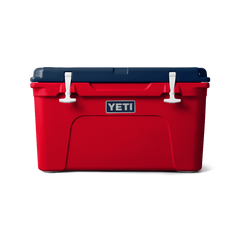 Front view of the limited edition 2024 YETI patriotic Tundra 45 Cooler. The top lid is navy blue, the base of the cooler is red, and the secure straps are white. The cooler shows a classic YETI brand logo on the front.