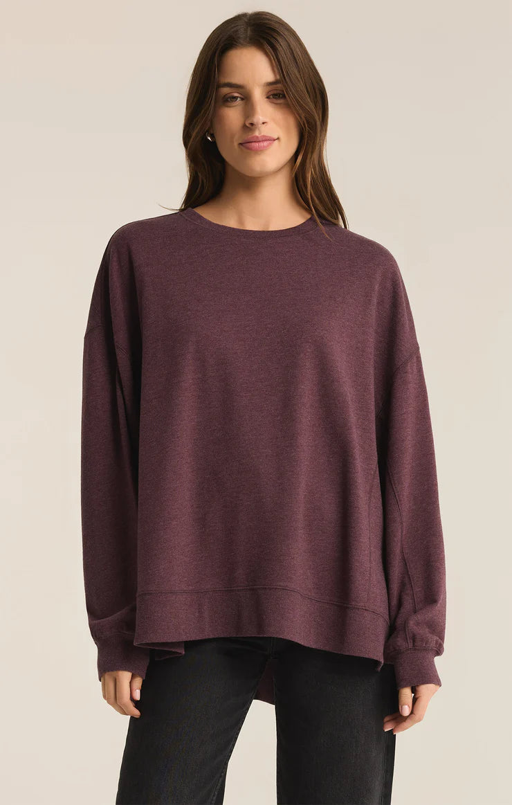 An all Berry Wine modern weekender sweater from the brand Z Supply.