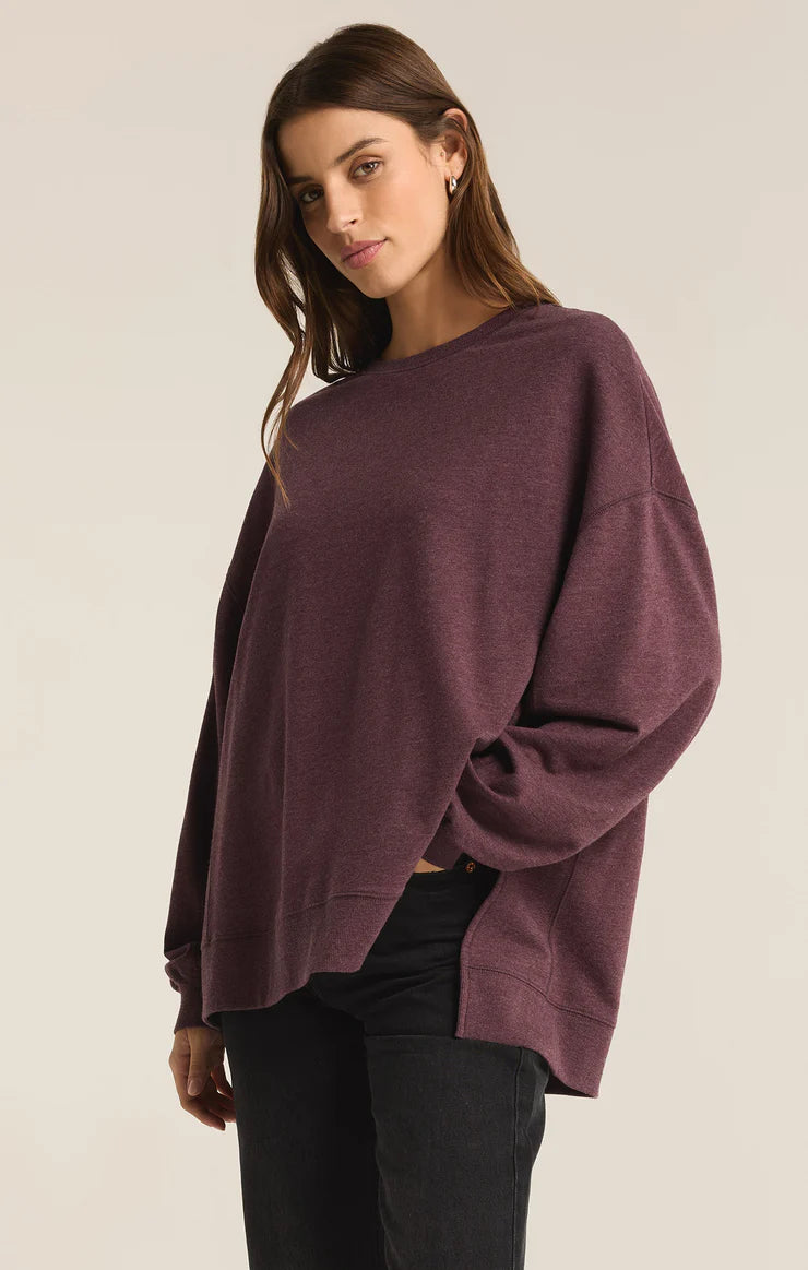 An all Berry Wine modern weekender sweater from the brand Z Supply.