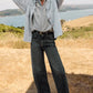 Z Supply model with black hair, wearing the All Day Knit Denim Jacket. The jacket features 6 front buttons, two chest pockets, and a collared top.