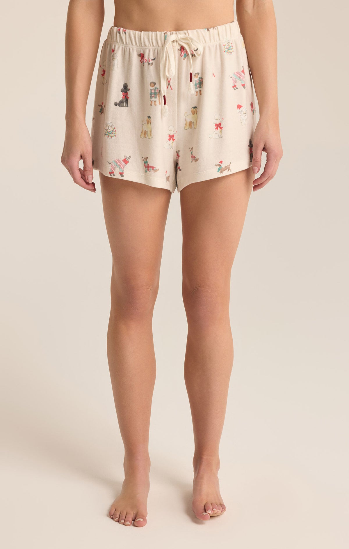 Lounge shorts with a draw string front. The shorts feature dogs dressed in Christmas outfits.