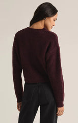 Full back view of the Destiny Sweater in the color Berry Red. The sweater stops at the hip. It's designed by the brand Z Supply.