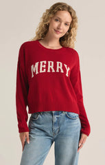 An all red knit sweater featuring the intarsia graphic "Merry." From the brand Z Supply.