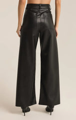 Women wearing black leather pants from the brand Z-Supply. Showing two back pockets.