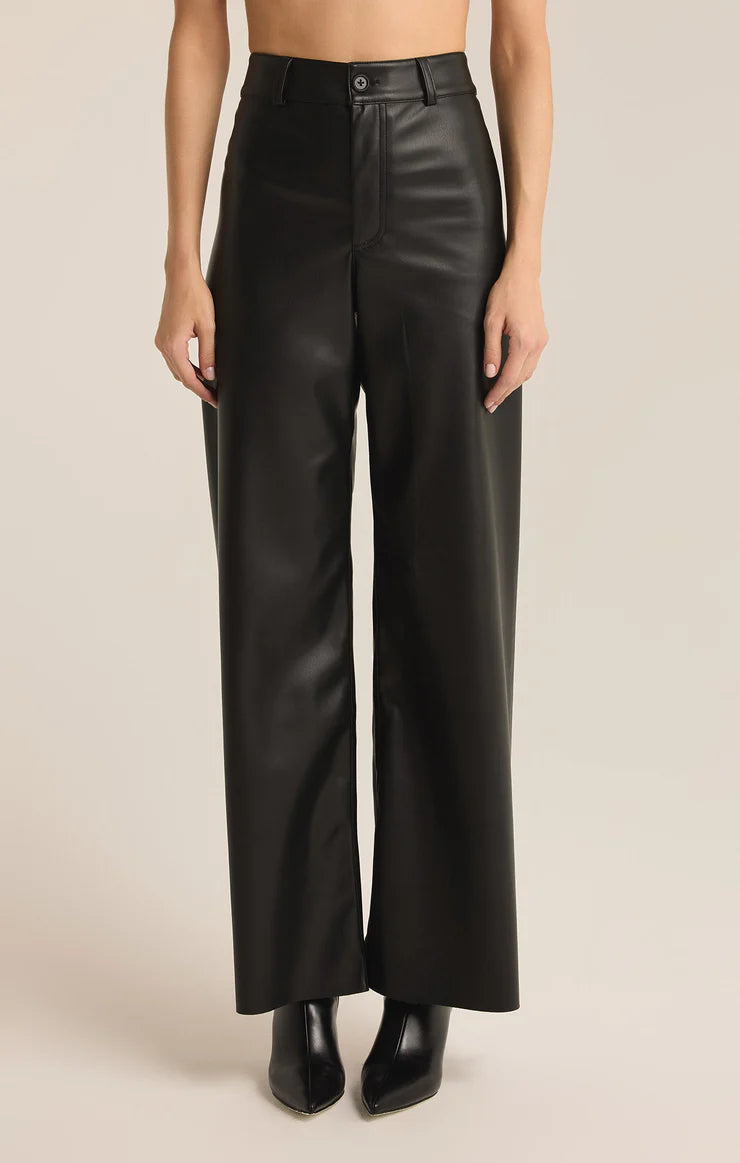 Women wearing black leather pants from the brand Z-Supply.