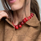 BaubleBar Joan Semi-Precious Necklace in Red worn with a brown collared jacket