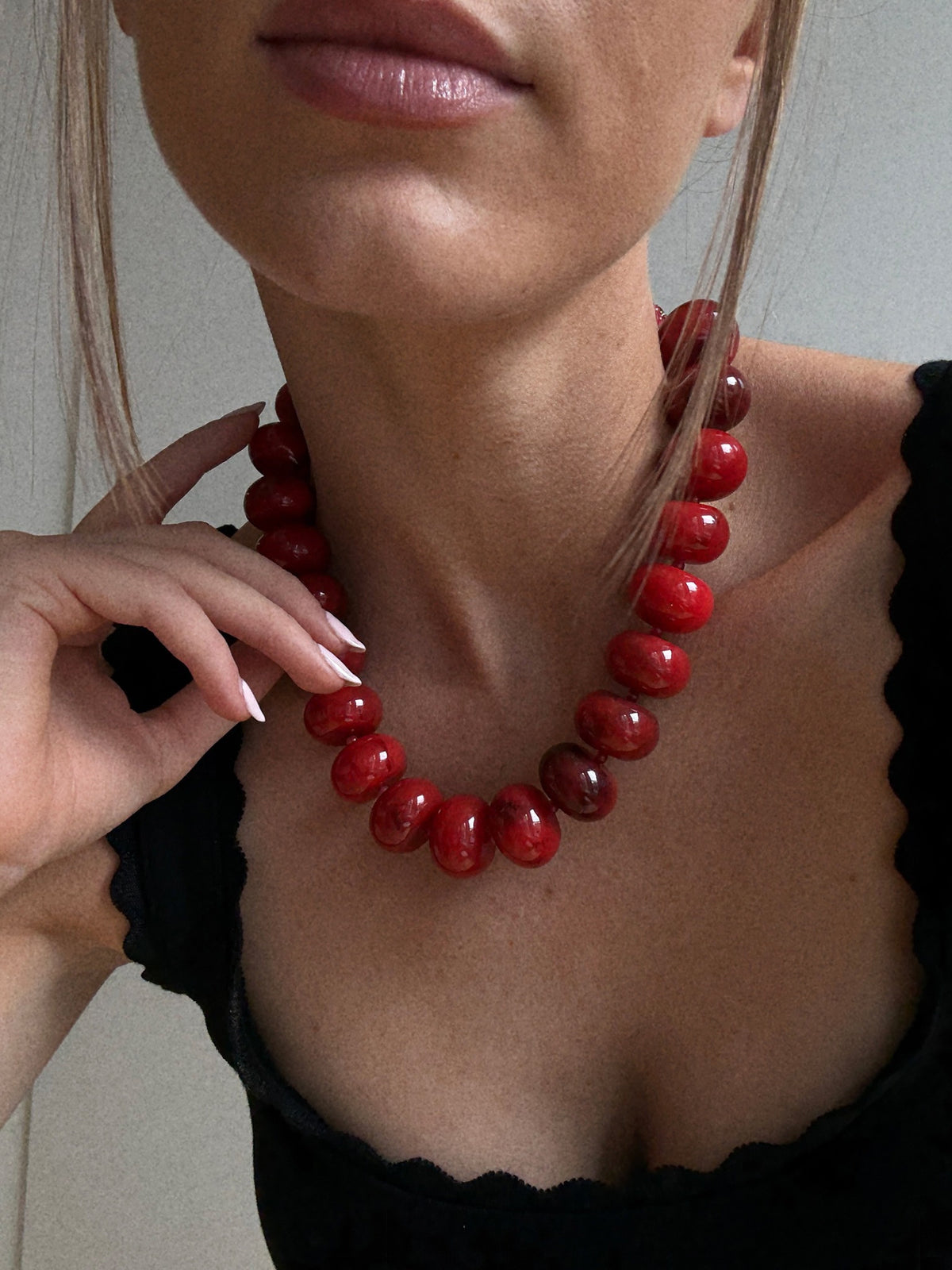 BaubleBar Joan Semi-Precious Necklace in Red worn with a black top