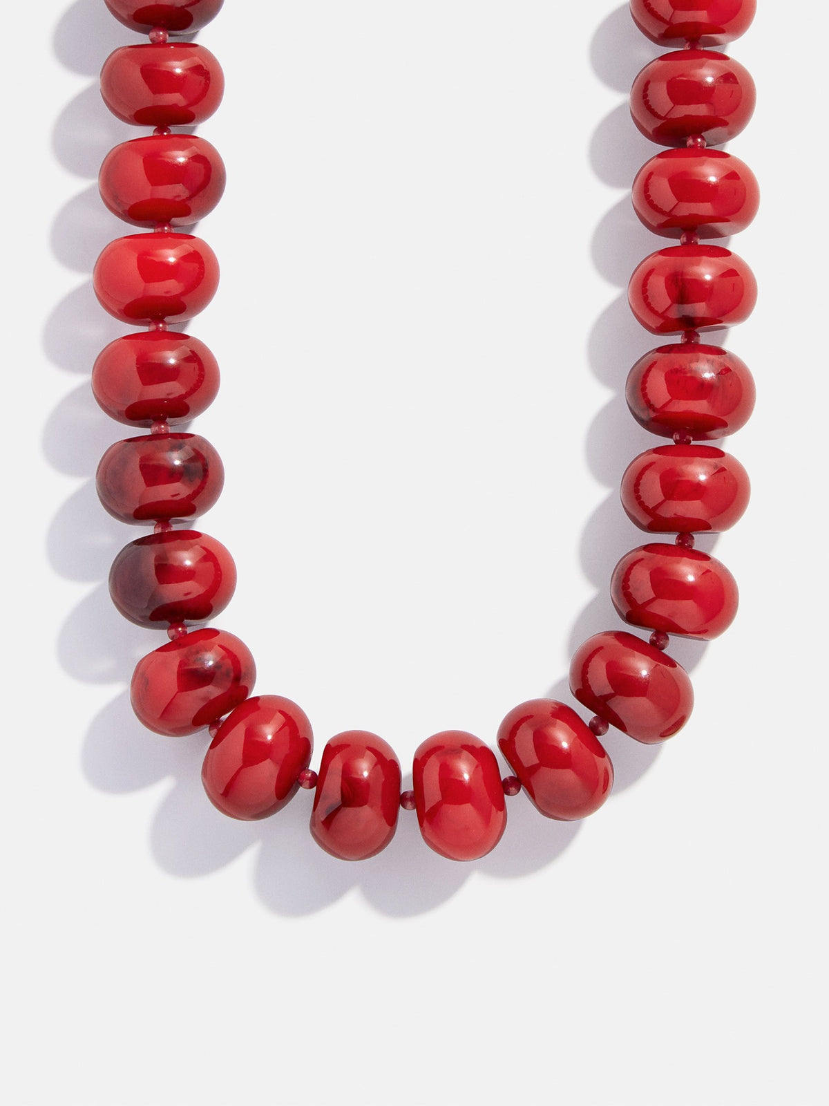 Close-up of red beads on the BaubleBar Joan Semi-Precious Necklace