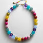 BaubleBar Mini Jane Beaded Necklace in Multi with colorful round beads, a gold-tone lobster clasp and beaded extender.