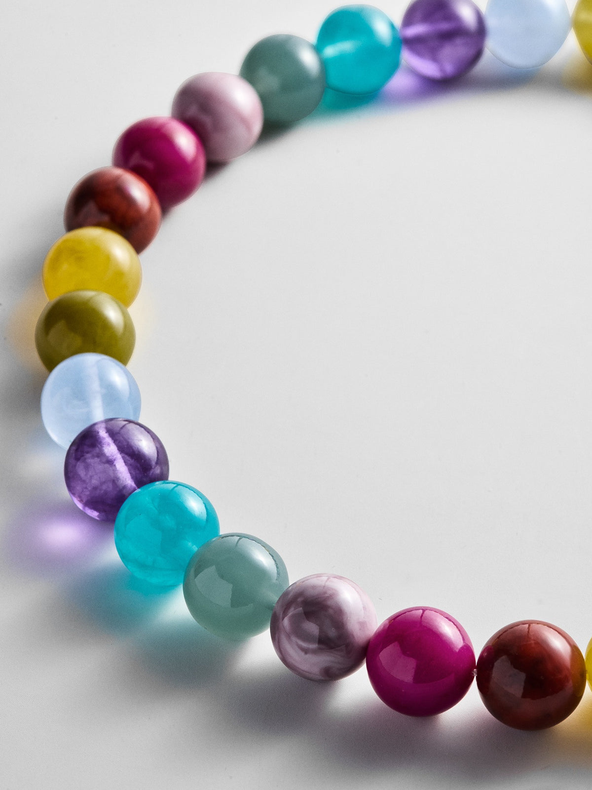 Close-up of the glossy multicolored beads on the BaubleBar Mini Jane Beaded Necklace.