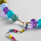 Gold-tone lobster clasp and colorful beaded extender on the BaubleBar Mini Jane Beaded Necklace in Multi.