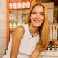 Model wearing the multicolored BaubleBar Mini Jane Beaded Necklace with a white sleeveless top.