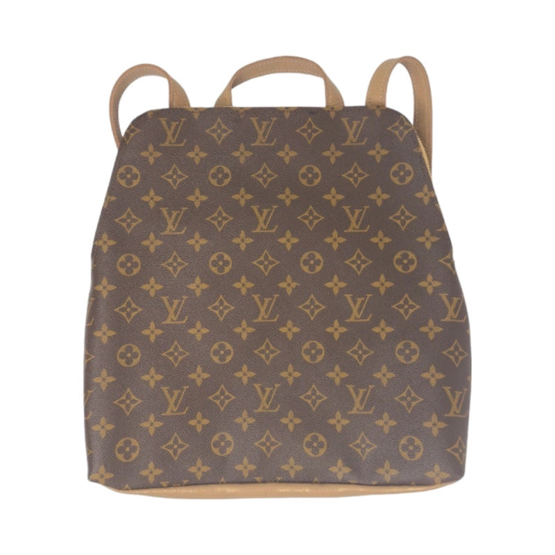 Front view of Beaudin Riley backpack in bronze with full monogram panel