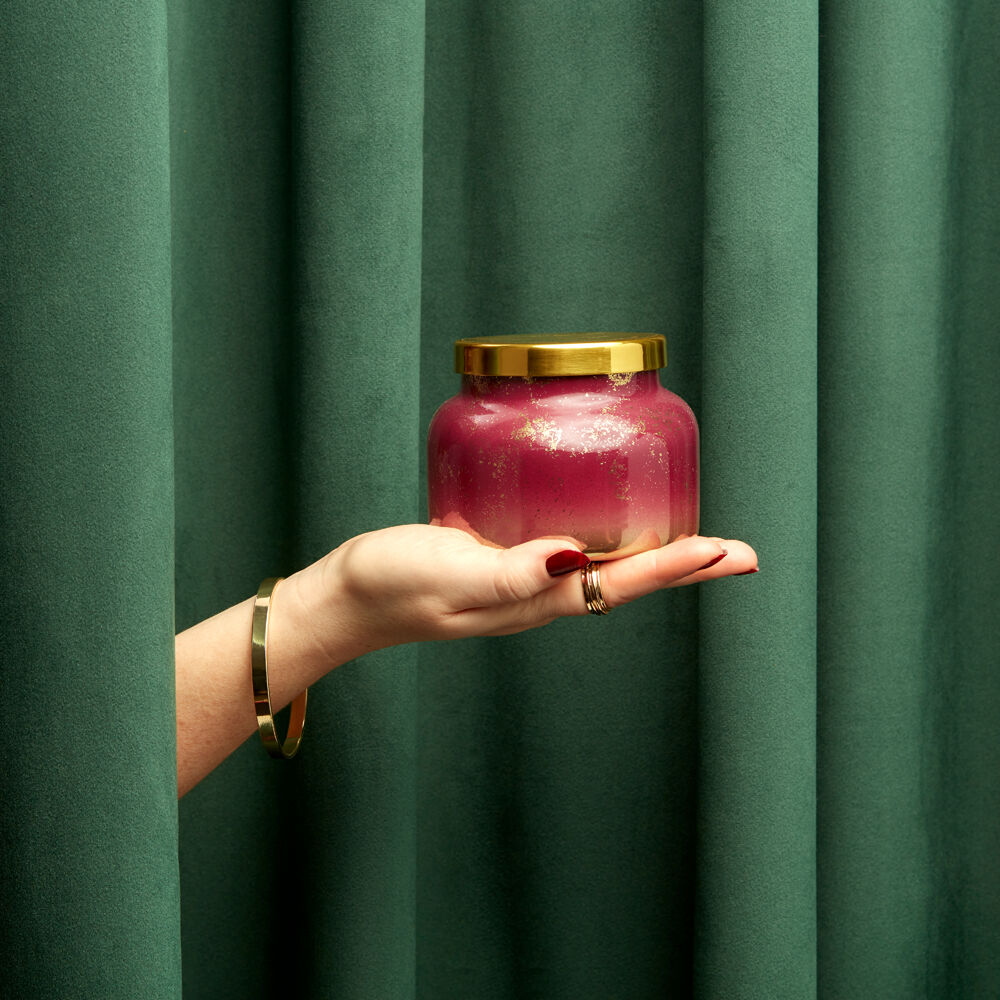 A 19 oz candle in a jar from the brand Carpi Blue. The scent of the candle is tinsel spice.