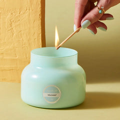 Aqua color Capri Blue candle. The candle is 19 oz.