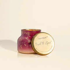 A petite 8 oz candle with Tinsel and spice scent. The candle comes from the brand Capri Blue.