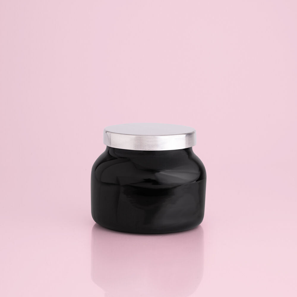 Petite size candle in the color black from the brand Capri Blue. The jar is 8 oz, and offers a powerful sugared citrus scent. It comes from the Capri Blue Volcano collection.