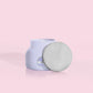 Petite size candle in the color lavender from the brand Capri Blue. The candle is 8 oz and offers a PUNCH of tropical fruits and sugared citrus.