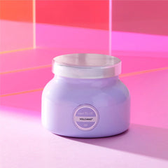 Petite size candle in the color lavender from the brand Capri Blue. The candle is 8 oz and offers a PUNCH of tropical fruits and sugared citrus.