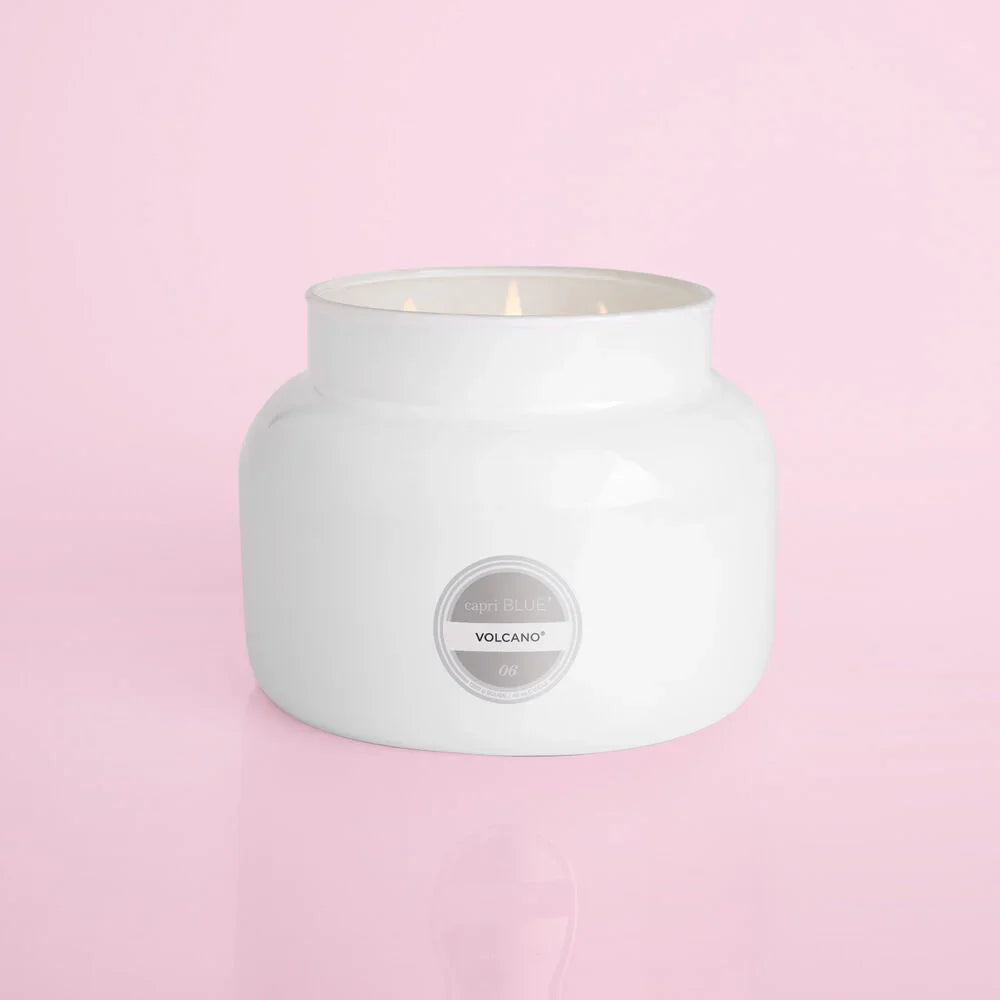 An oversized white candle from the brand Capri Blue. The candle is from the Capri Blue Volcano collection. This jar features 3 wicks and is 28 oz.