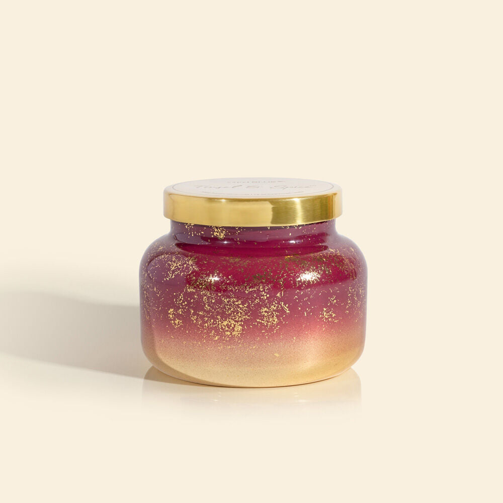 A 19 oz candle in a jar from the brand Carpi Blue. The scent of the candle is tinsel spice.