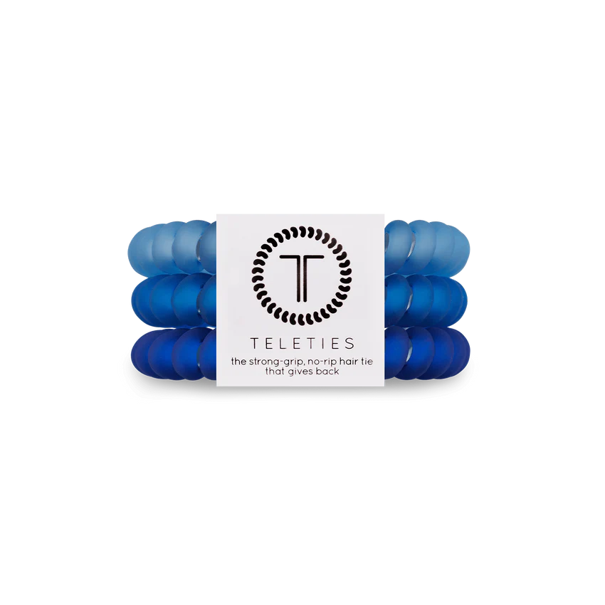 A pack of 3 small sized hair ties in the color blue. From TELETIES.