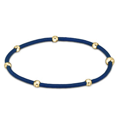 Navy blue colored bracelet with gold beads from Enewton.